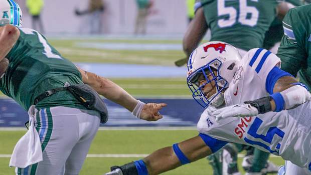 Ponies' Cameron Robertson dives at Tulane quarterback Michael Pratt in AAC title game